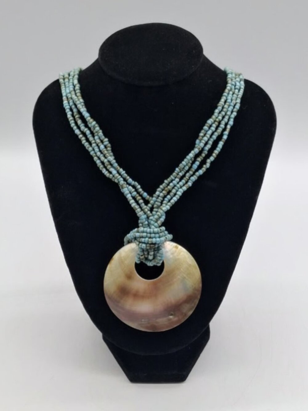 Santa Fe Style Turquoise Color Bead Four Strand Necklace with Shell Centerpiece
